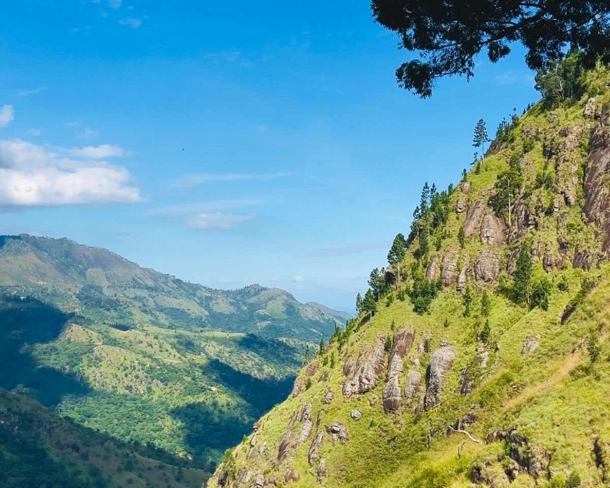 Green mountain cliffs and valleys viewed from Ella Rock