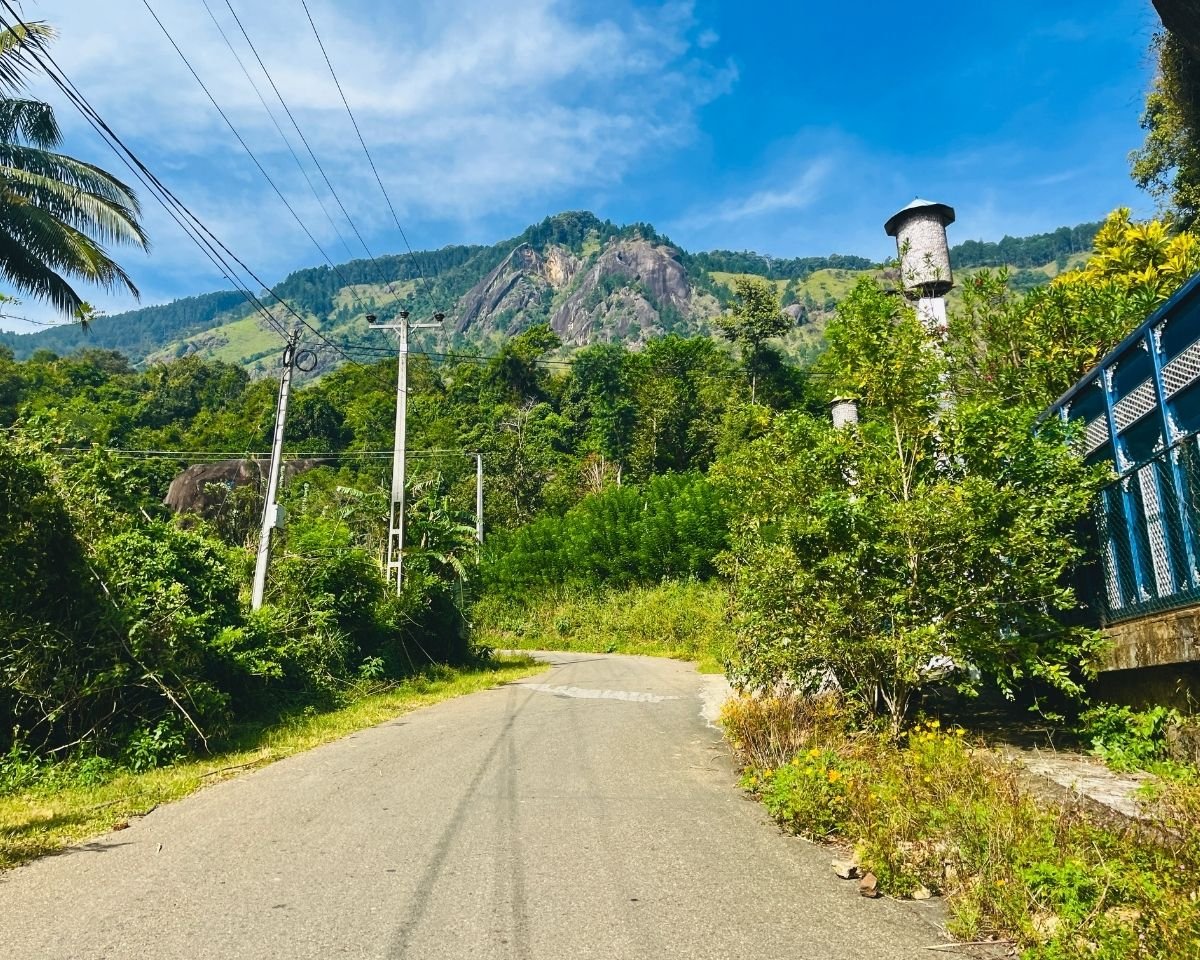 Road leading toward the rocky mountain landscape of Kurullangala