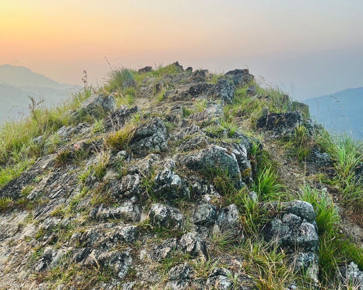 Rocky hilltop glowing in the early morning light