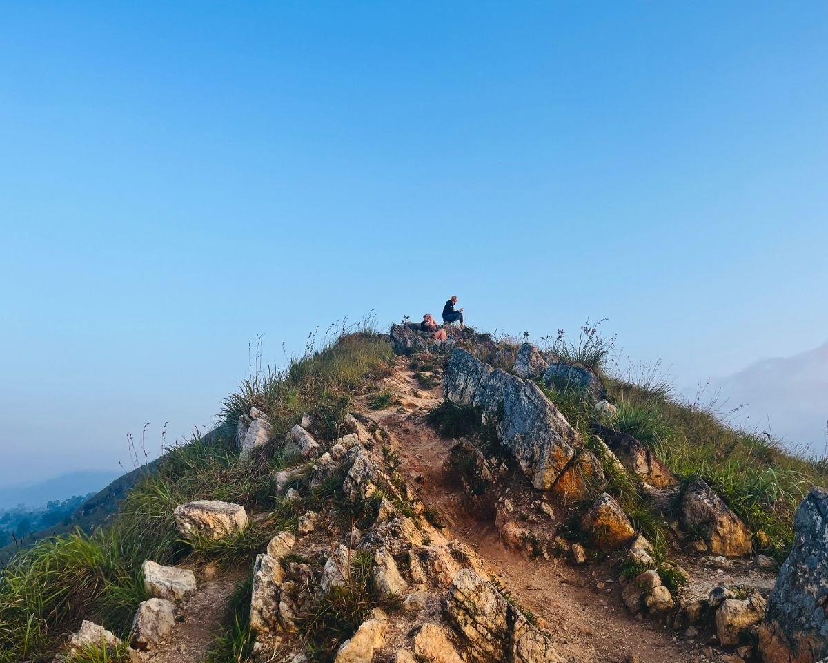 Rocky trail descending along a narrow ridge