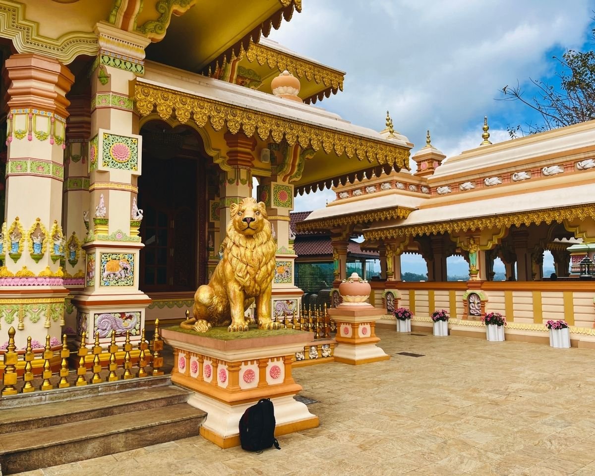 Golden lion statue guarding the monastery courtyard