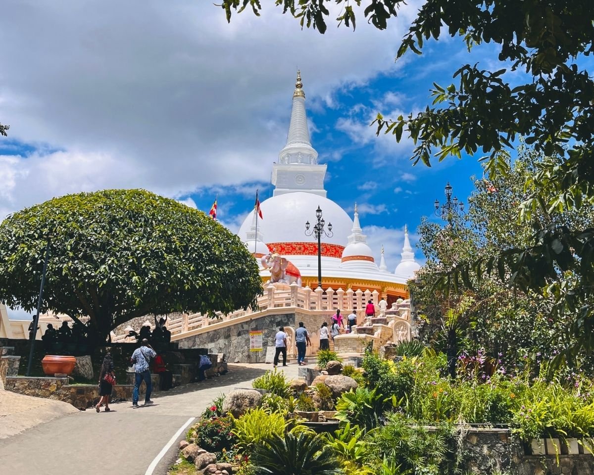 Garden pathway leading toward the Sri Satbudu Maha Seya