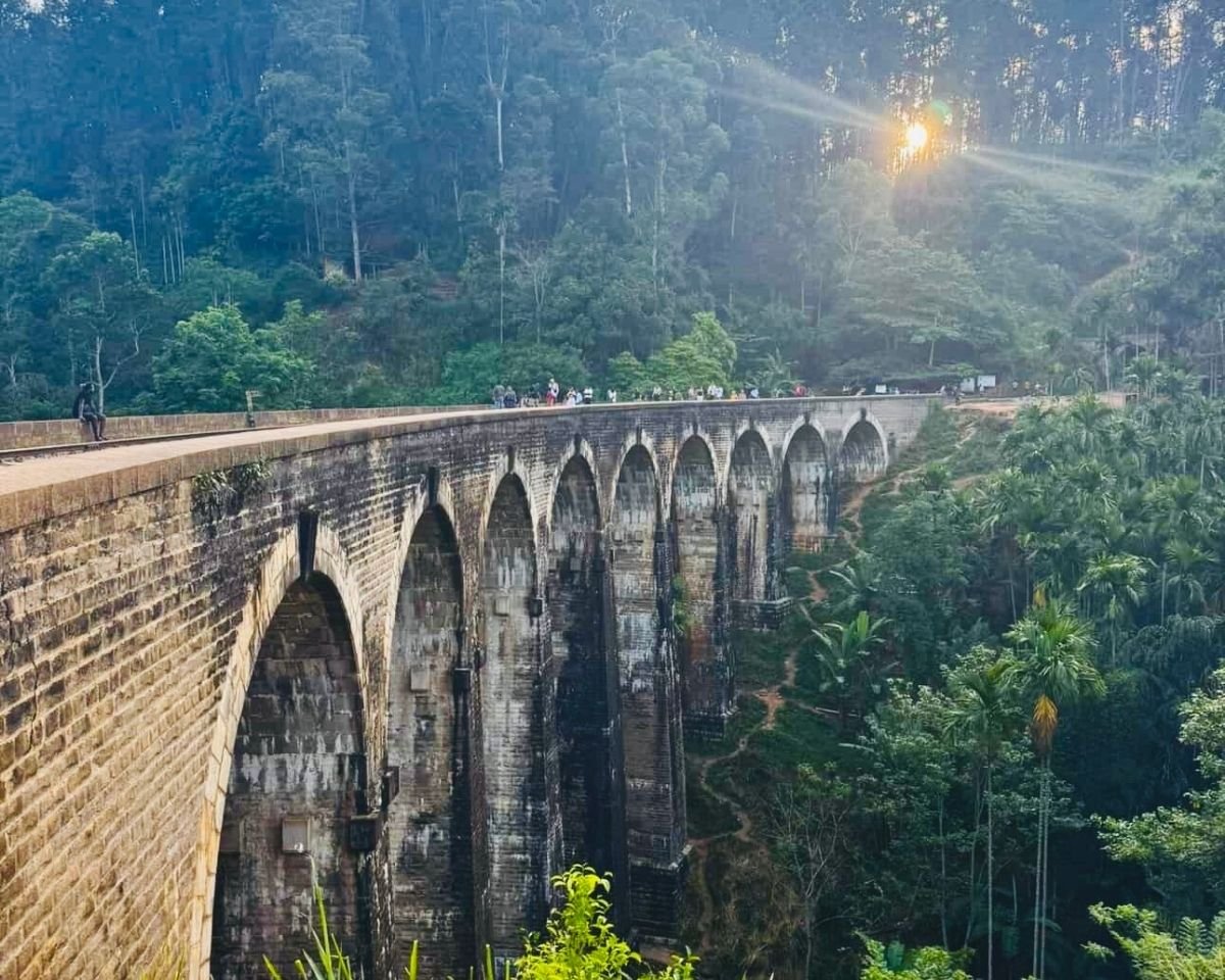 Sunset light shining across Nine Arch Bridge and the valley
