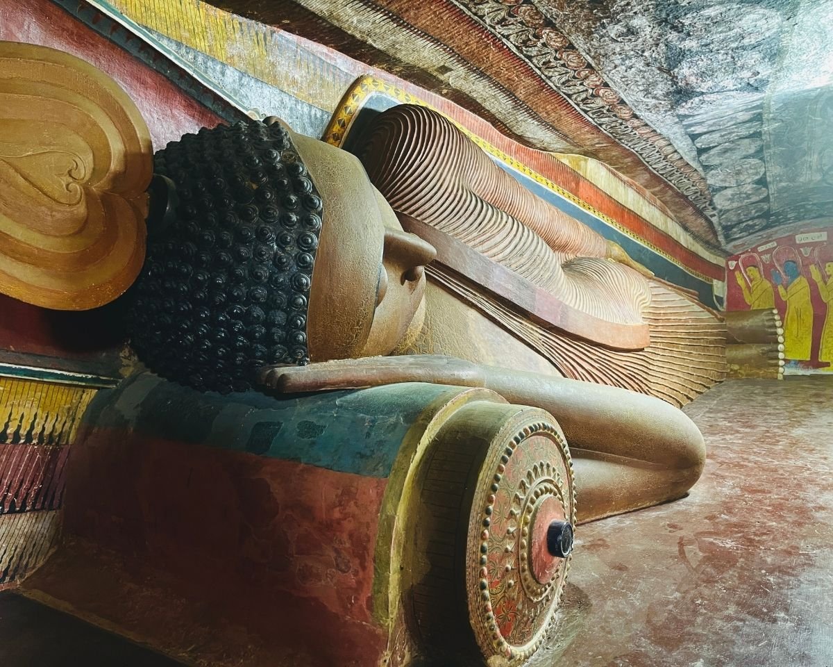 Reclining Buddha statue inside the cave temple