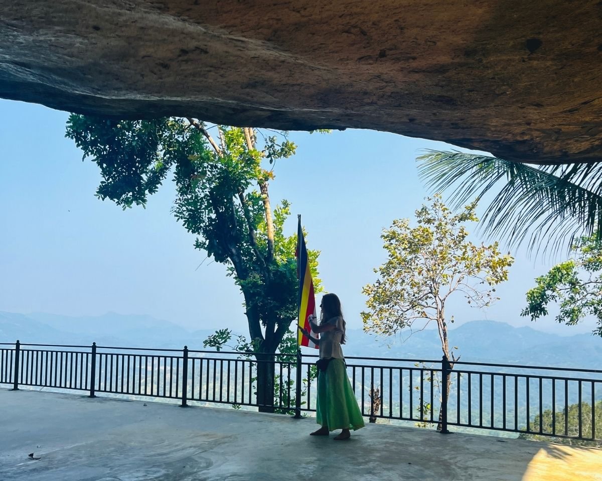 Mountain-view terrace beneath a natural rock shelter
