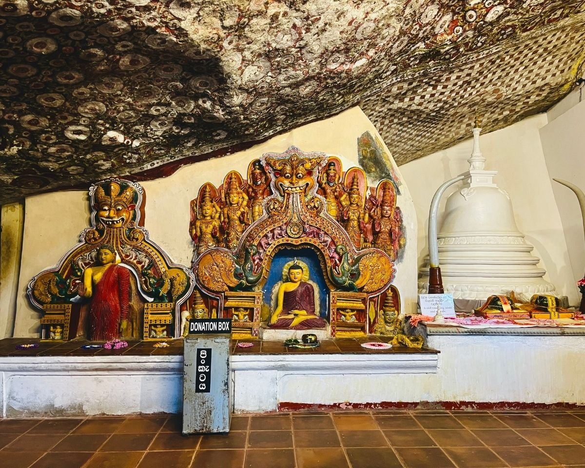 Buddha statues and shrines inside the cave temple