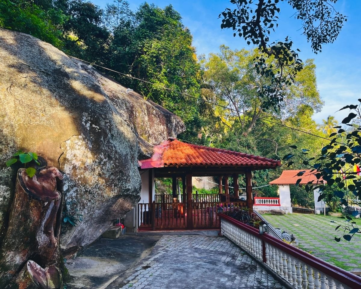 Stone pathway beside a large rock formation