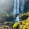 Bomburuella Waterfall Pool Bomburuella Waterfall main cascade dropping into emerald plunge pool with mist and sunlit moss rocks at base in Nuwara Eliya Sri Lanka
