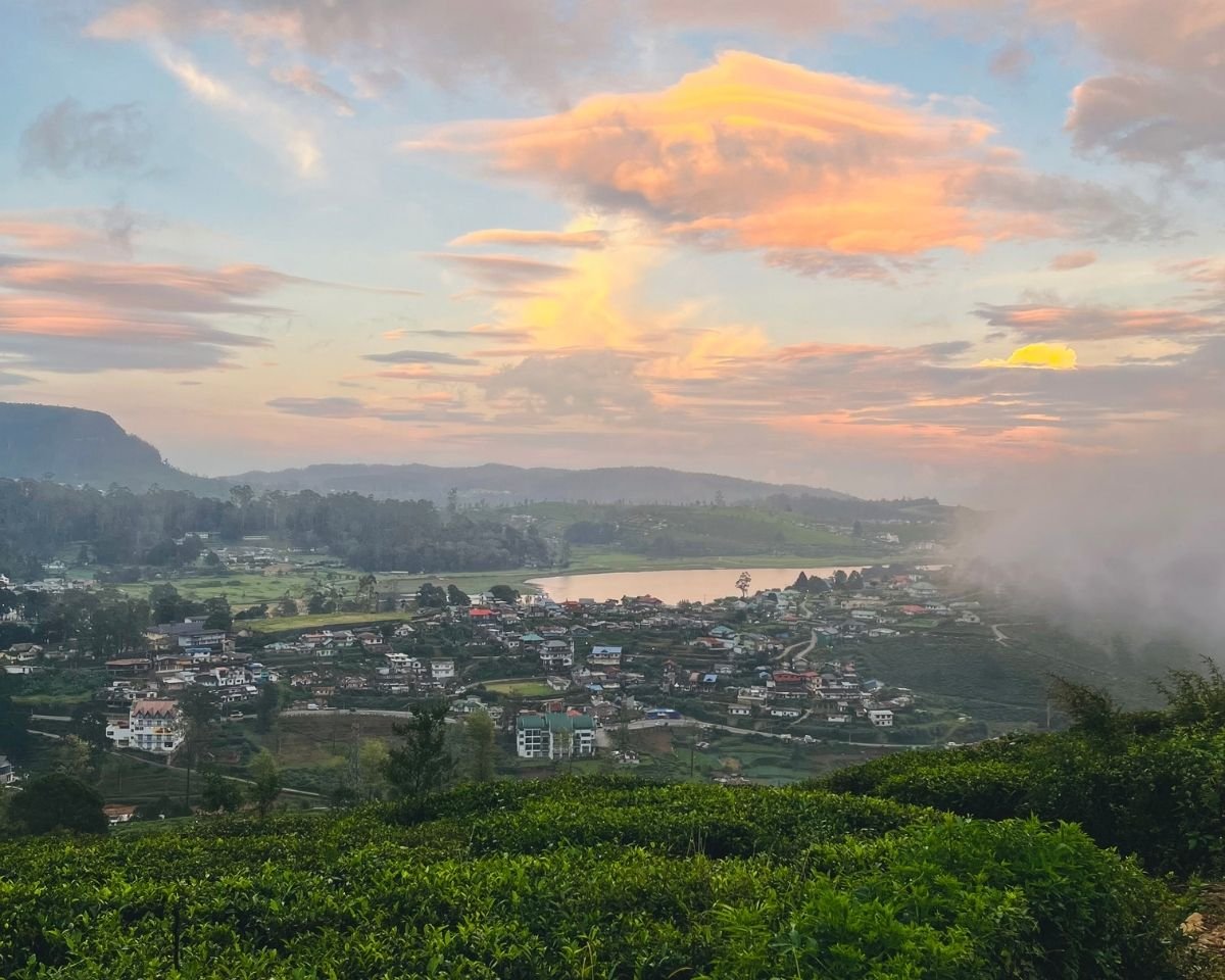 View of Gregory Lake and Nuwara Eliya town with tea plantations at sunset from Single Tree Hill viewpoint near Swarnagiri temple Sri Lanka