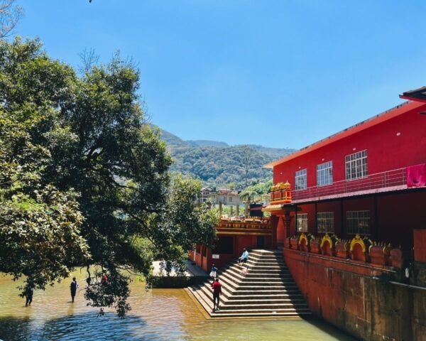 Seetha Amman Kovil - Bathing Ghat at Seetha Eliya in Nuwara Eliya Stone steps and red temple building at the bathing ghat on Seetha Eliya stream beside Seetha Amman Kovil Hindu temple, Nuwara Eliya, Sri Lanka